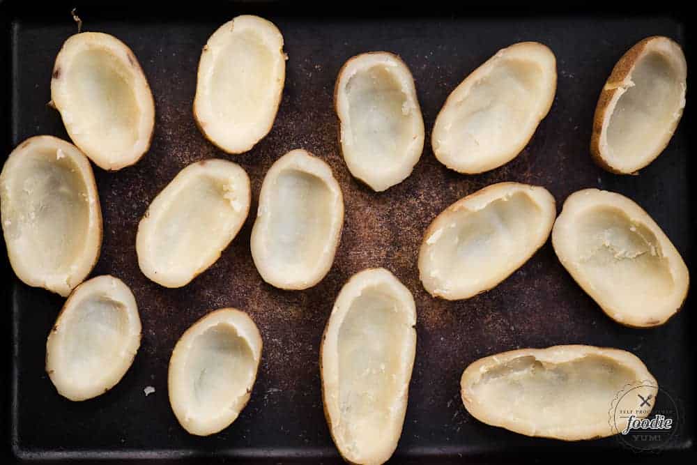 cooked russet potatoes with the centers scooped out