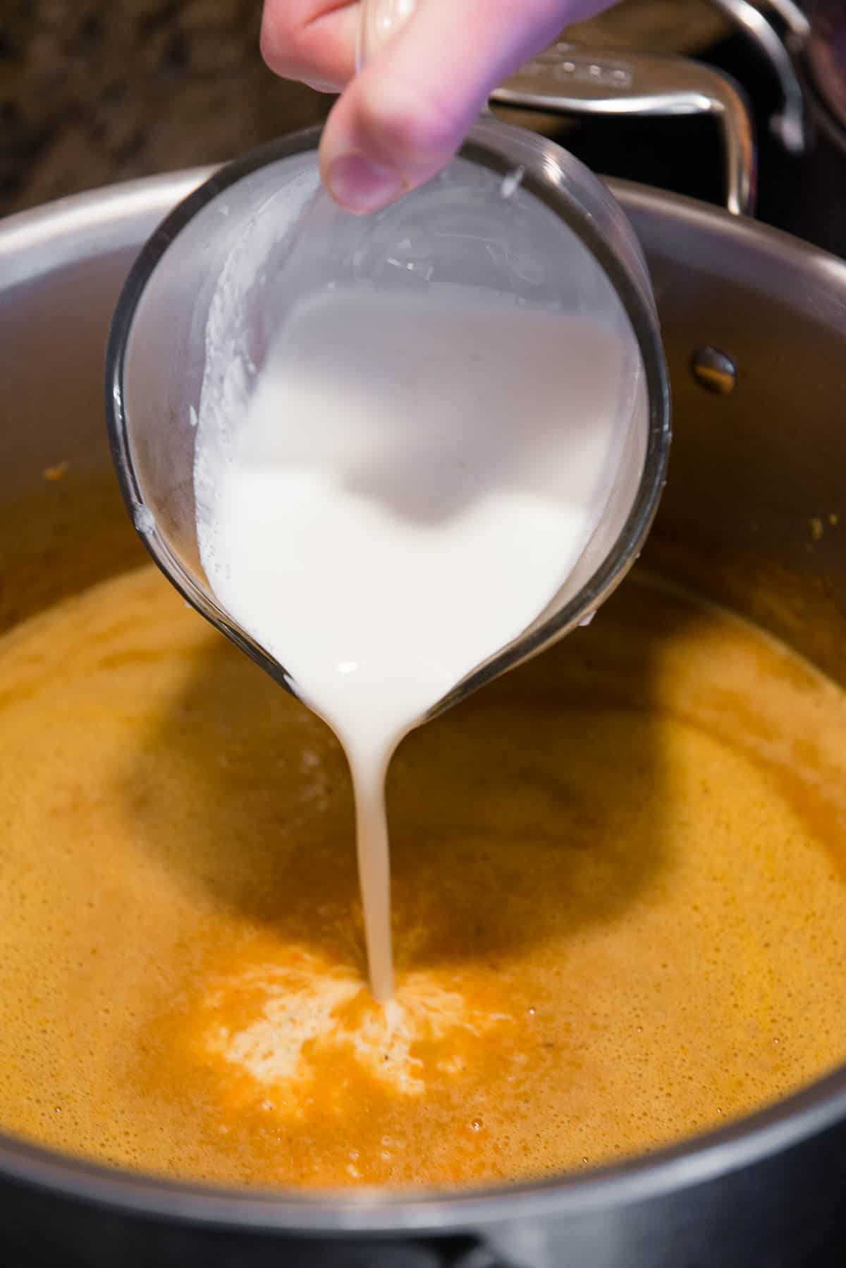 adding heavy cream to soup