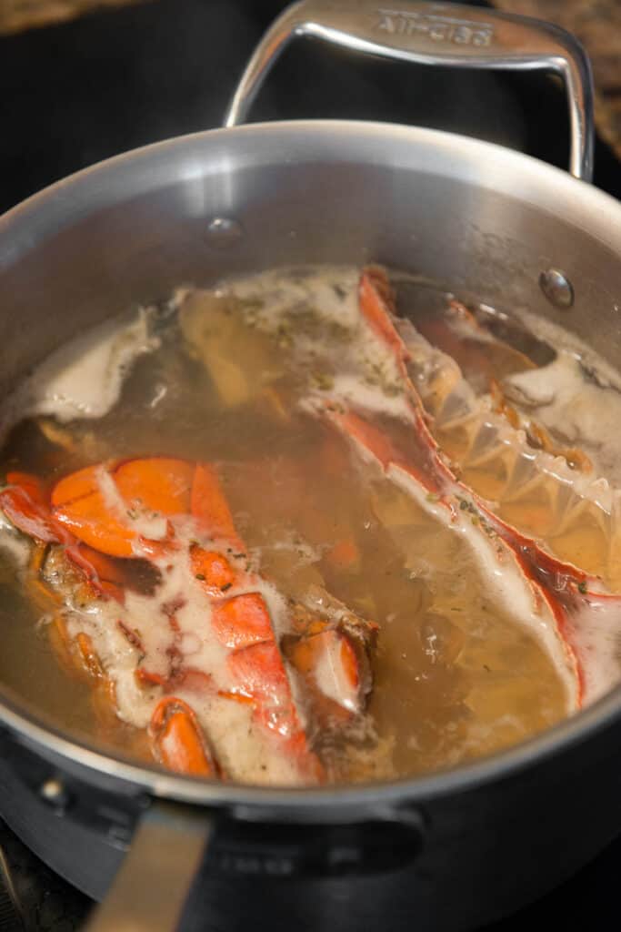 lobster tail shells simmering in water to make stock