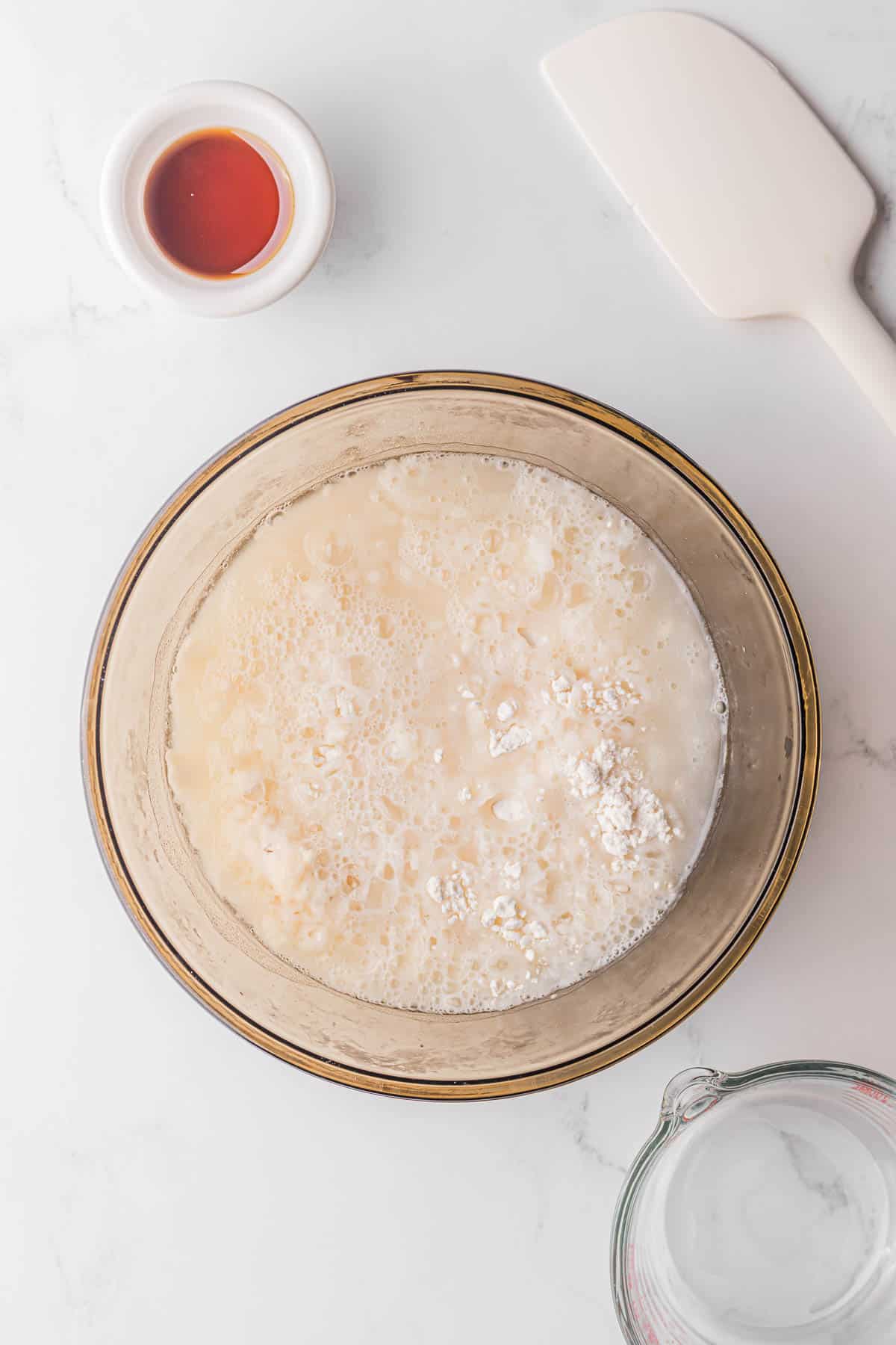 mixing flour and water to make Mandarin pancakes.