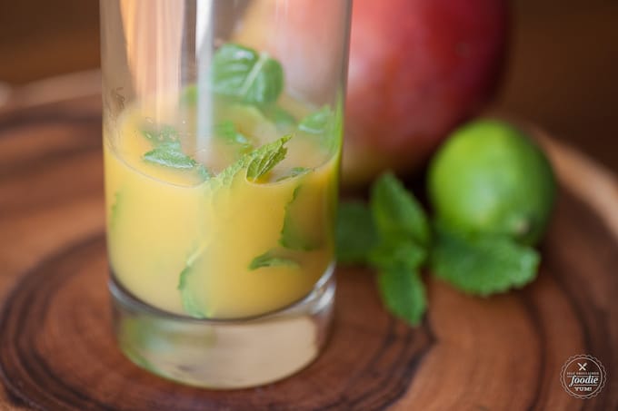 a glass with mint and liquid