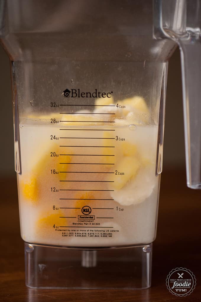 mango, pineapple, banana and liquid in blender