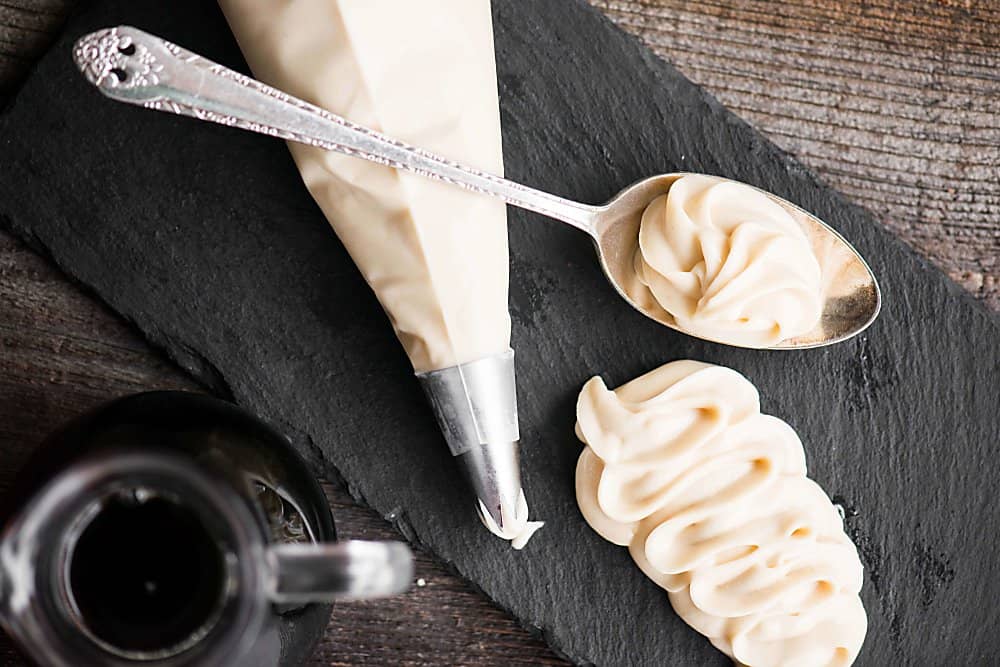 cream cheese frosting on a spoon