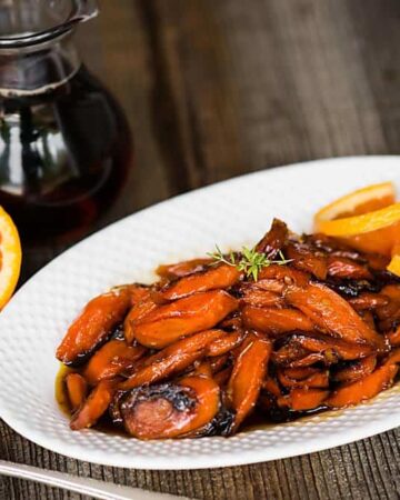 Maple Orange Roasted Carrots, with pure maple syrup, orange, and herbs, are an easy carrot side dish that is perfect for any dinner or holiday feast.
