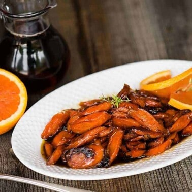 Maple Orange Roasted Carrots, with pure maple syrup, orange, and herbs, are an easy carrot side dish that is perfect for any dinner or holiday feast.