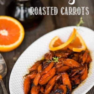 maple orange roasted carrots on a white plate