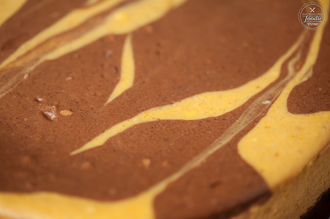 A close up of a chocolate pumpkin cheesecake