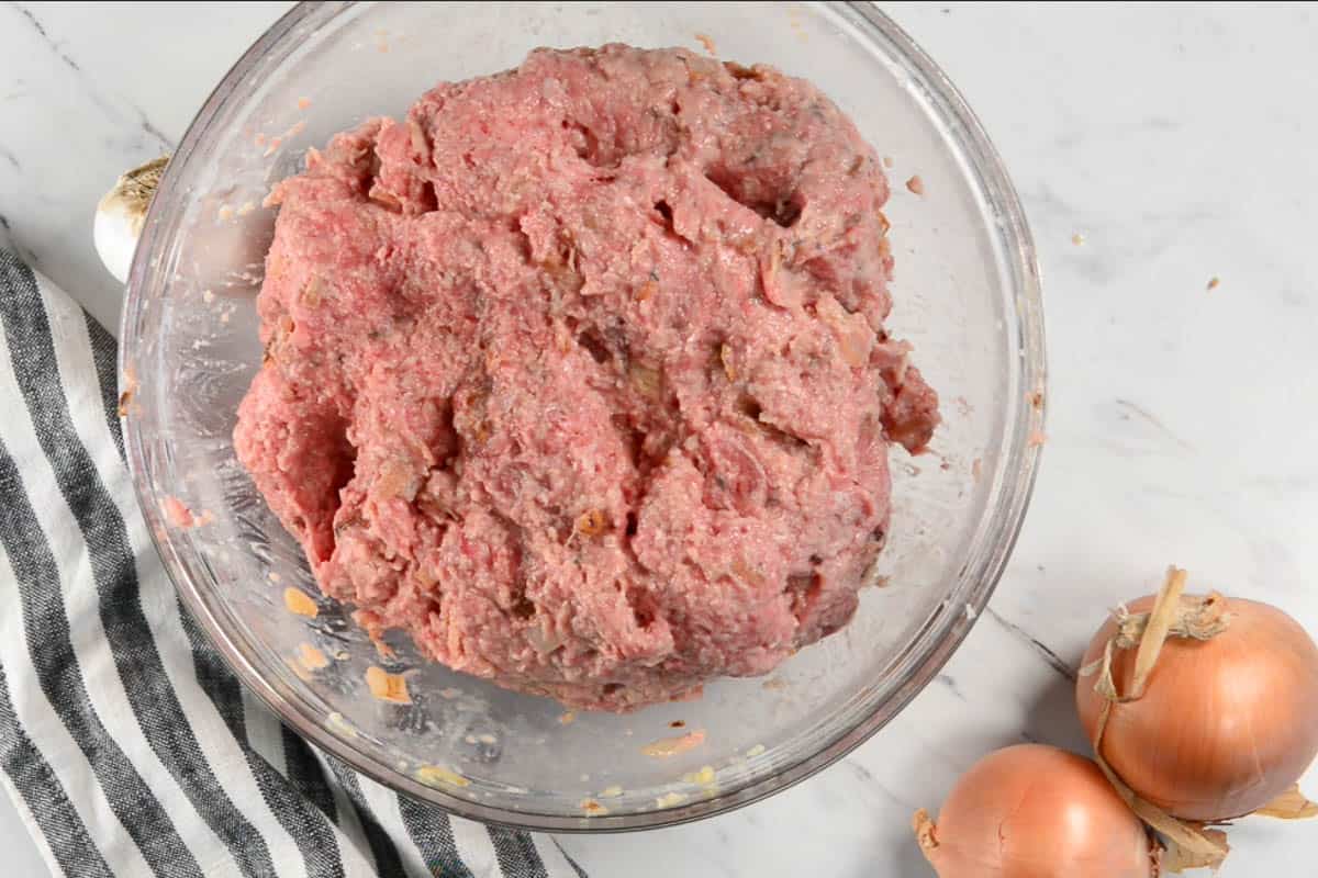 mixed meatloaf ingredients in bowl.