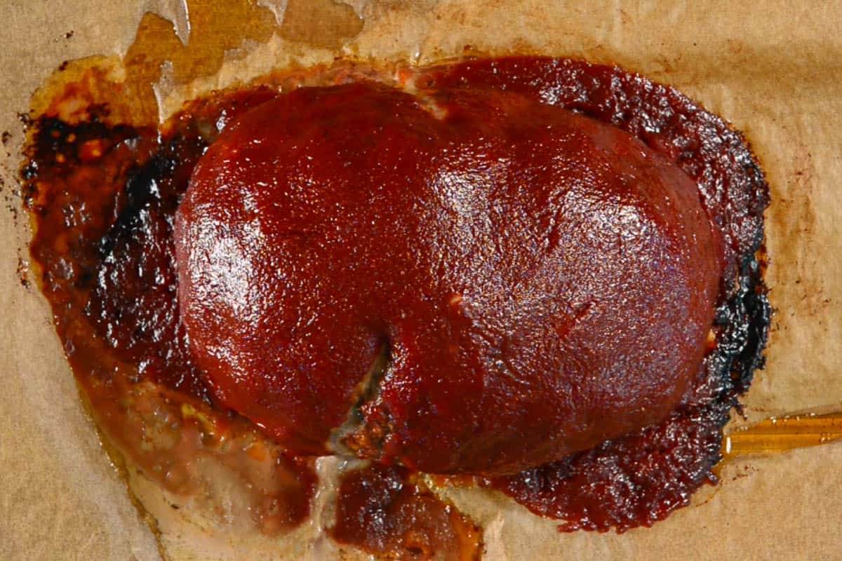 baked meatloaf with ketchup sauce.
