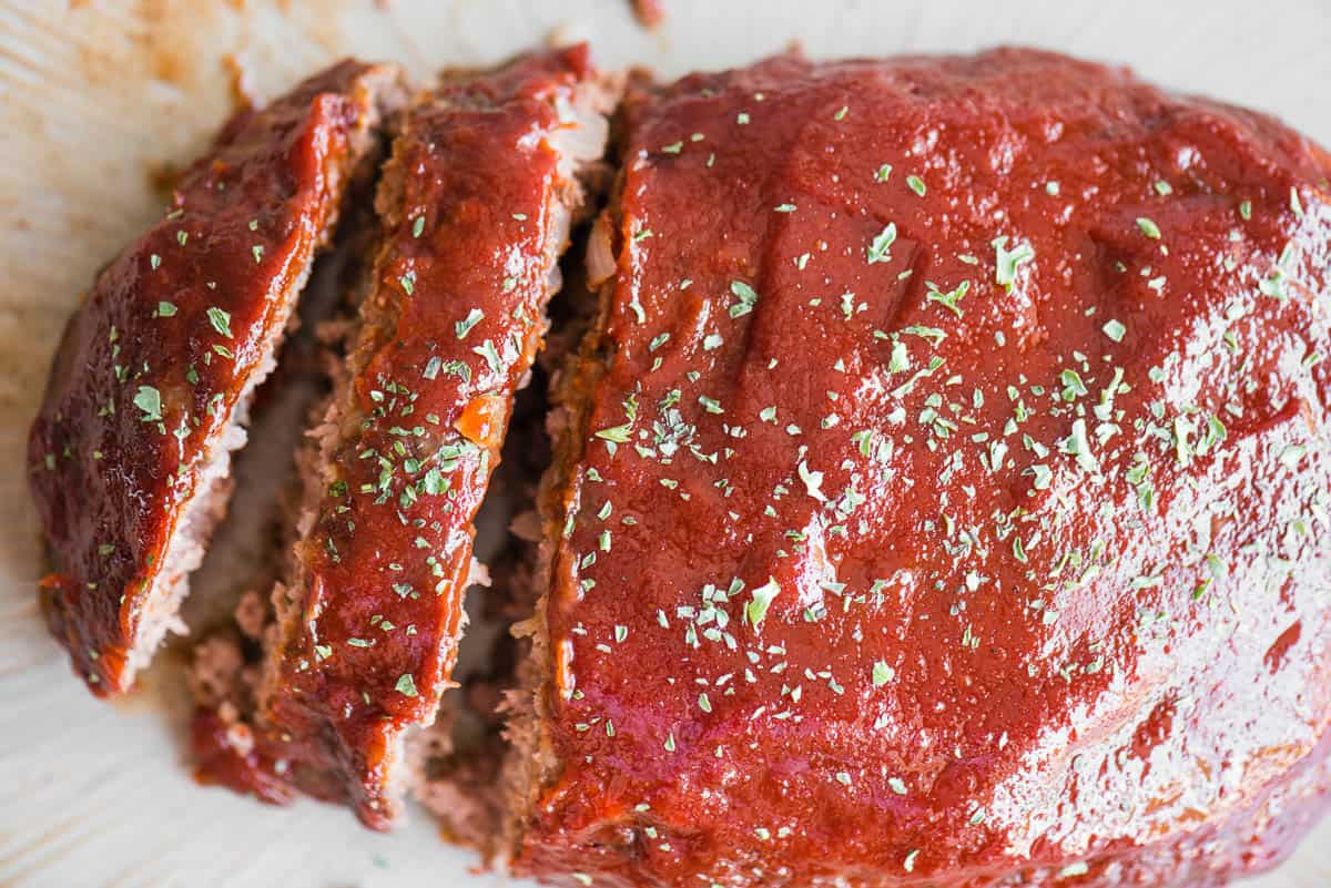 slices of meatloaf with ketchup sauce.