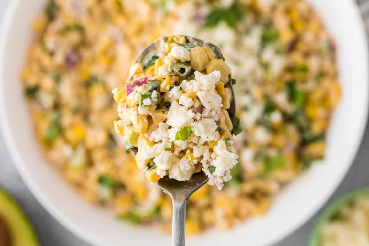 spoonful of Mexican street corn salad.