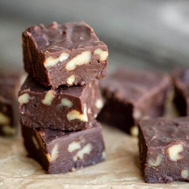 stack of homemade microwave fudge with walnuts.