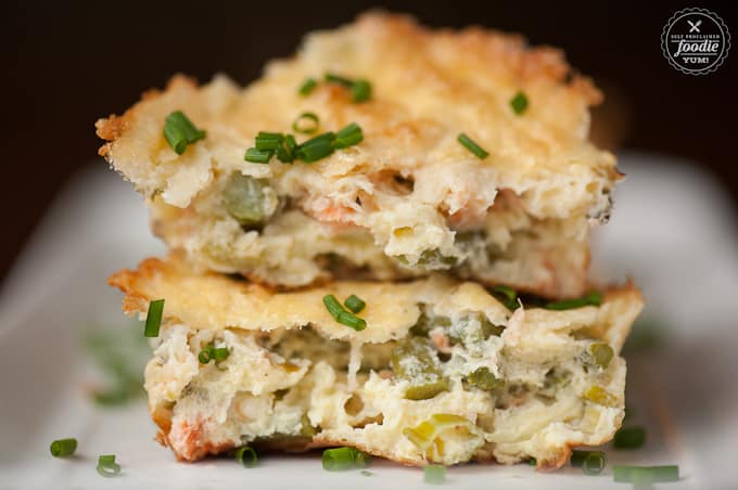 A close up of salmon asparagus Frittatas split in half