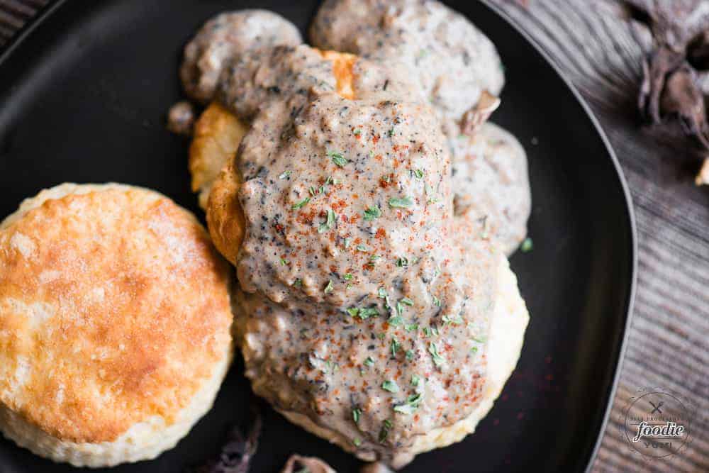 looking down at a plat of biscuits and country mushroom gravy