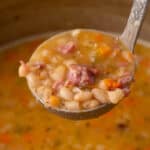 ladle of navy bean soup.