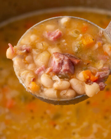 ladle full of homemade navy bean soup.
