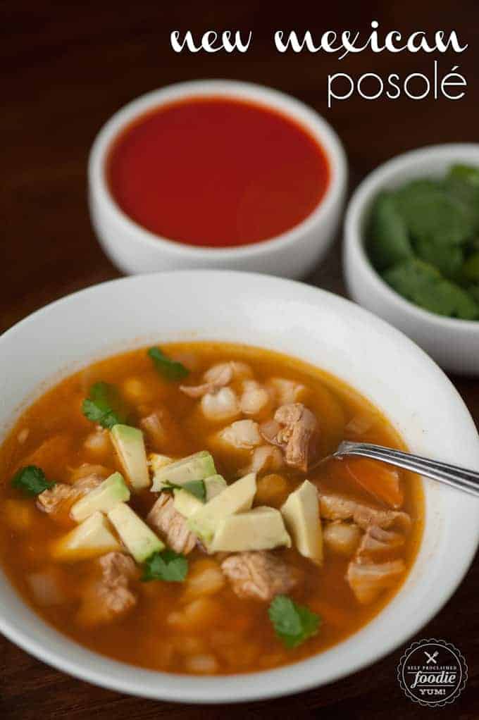 bowl of homemade posole with chile sauce