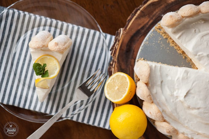 A plate of lemon ladyfinger cheesecake with a fork