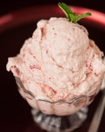 When you're looking for a tasty summer treat to help cool you down, nothing quite beats some creamy homemade Old Fashioned Strawberry Ice Cream.