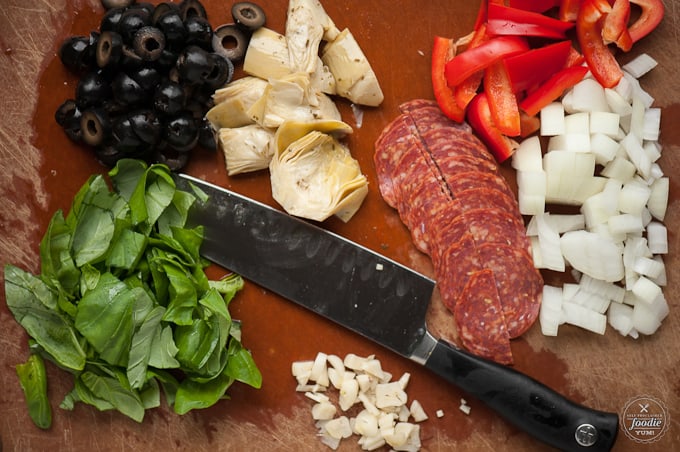 chopped pepperoni, onions, peppers, garlic, olives, artichoke, basil