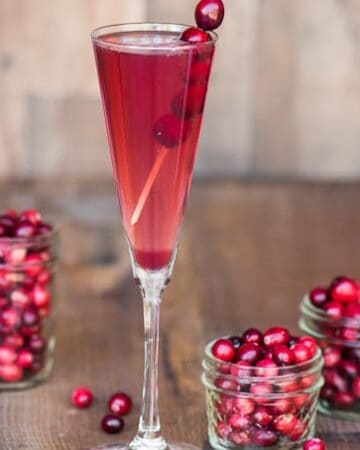 Orange Cranberry Prosecco is an easy single serving winter cocktail made from sweetened tart cranberry juice, orange liqueur, and Riondo Prosecco.