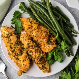 parmesan herb crusted chicken tenders with green beans.