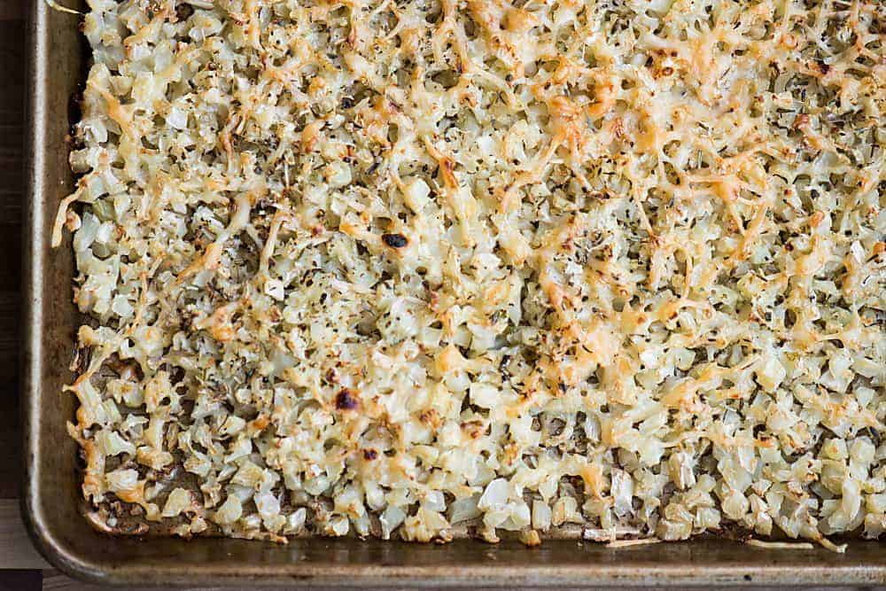 cauliflower on baking sheet that has been roasted with parmesan