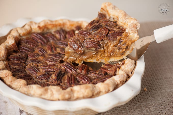 a slice of pumpkin pecan pie