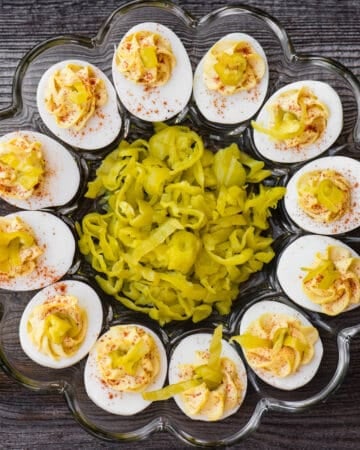 tray of deviled eggs with pepperoncinis