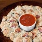 Pepperoni Pizza Pull Aparts take traditional pizza ingredients and turn them into a two bite appetizer perfect for any party or game day feast.