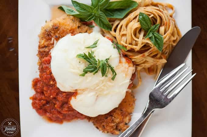 top down photo of chicken parmesan with pasta