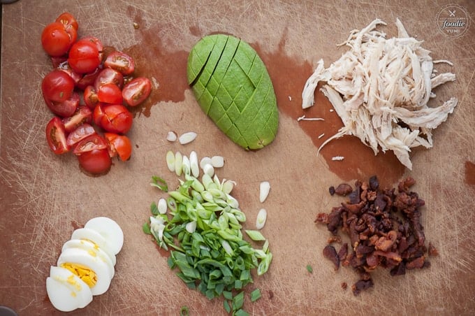 Perfect Cobb including tomato, hard boiled egg, avocado, green onion, chicken, bacon