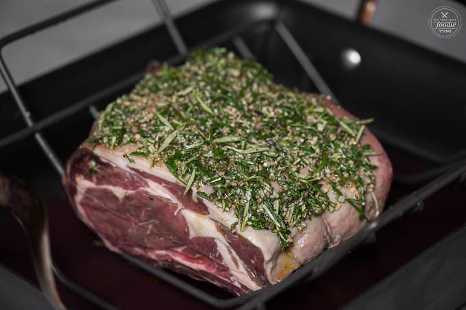 Prime Rib in roasting pan with herb crust