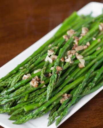 Perfect Garlic Sauteed Asparagus is the best way to cook asparagus. This delicious and easy garlic asparagus is cooked in less than ten minutes!