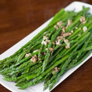 Perfect Garlic Sauteed Asparagus is the best way to cook asparagus. This delicious and easy garlic asparagus is cooked in less than ten minutes!