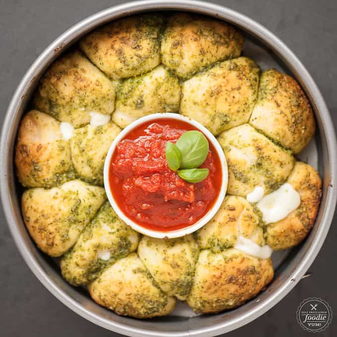 top view of pesto cheese bombs with marinara