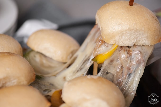 A close up of food, with Slider and Cheesesteak
