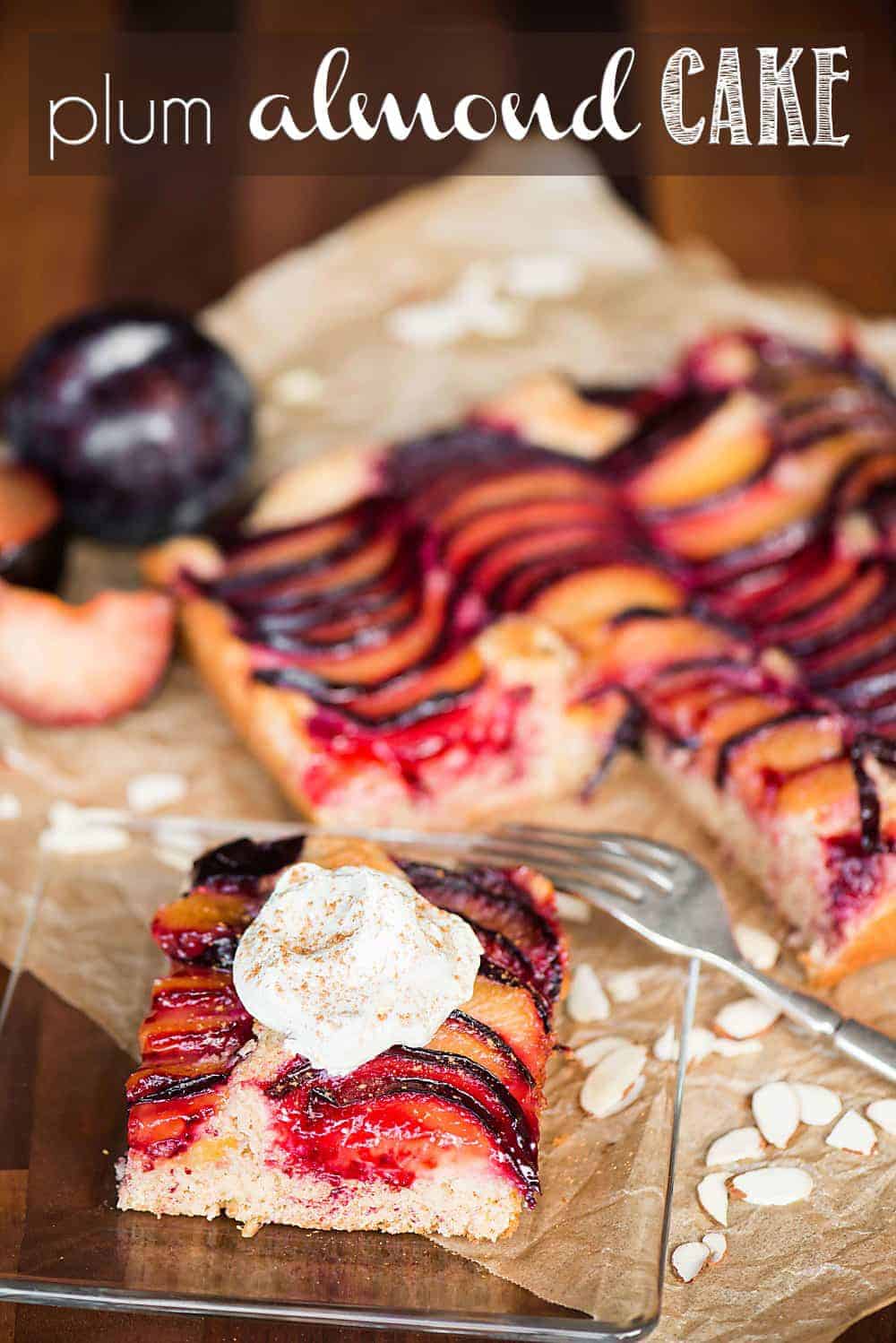 plum almond cake topped with whipped cream