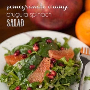 If you're looking for the perfect healthy winter side salad, this Pomegranate Orange Arugula Spinach Salad with a homemade vinaigrette is full of flavor.