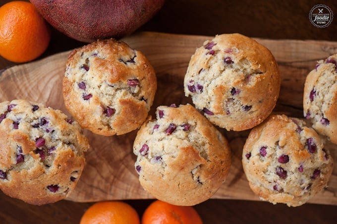 tops of homemade muffins that have pomegranate seeds