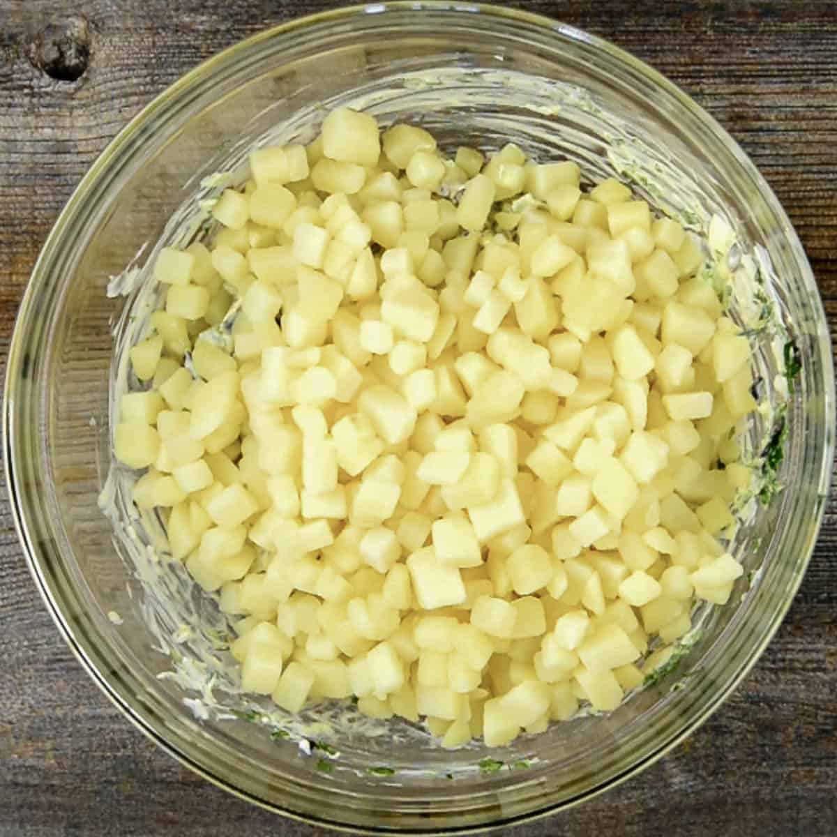 cooked chopped potatoes in bowl