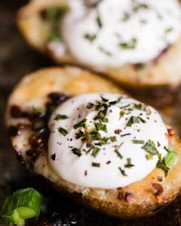 homemade potato skin with cheese, bacon and sour cream