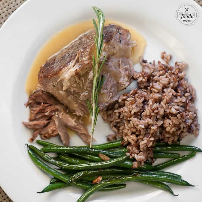 Plate with pressure cooker pork roast, gravy, rice and green beans