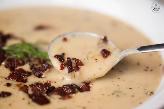 spoonful of potato leek soup with bacon