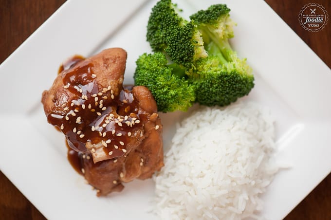 A plate of food with rice, broccoli, and shoyu chicken