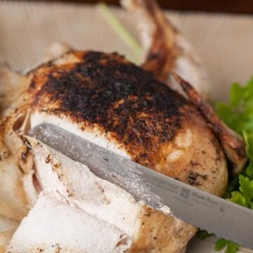 pressure cooker whole chicken being cut