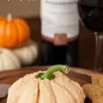 This delicious Pumpkin Cheese Ball made with real pumpkin and three different kinds of cheese is the perfect fall party appetizer when served with wine.