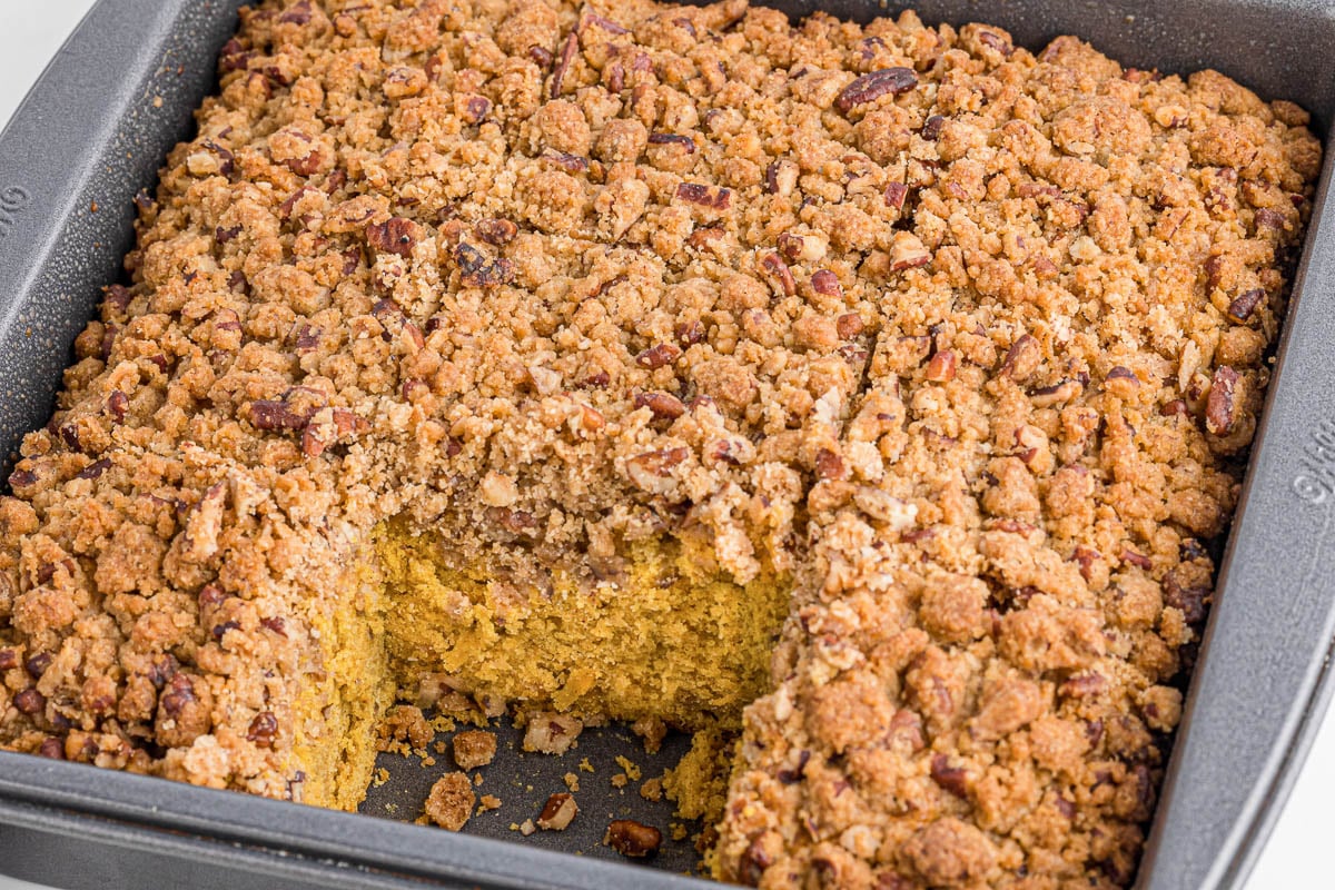 pumpkin coffee cake with piece cut out.