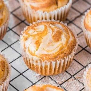 pumpkin cream cheese muffins on cooling rack.