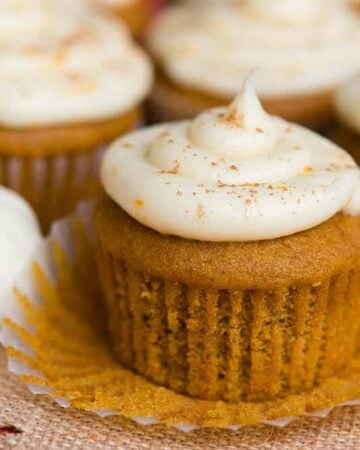 Pumpkin Cupcakes with a Citrus Cream Cheese Frosting with muffin liner pulled down